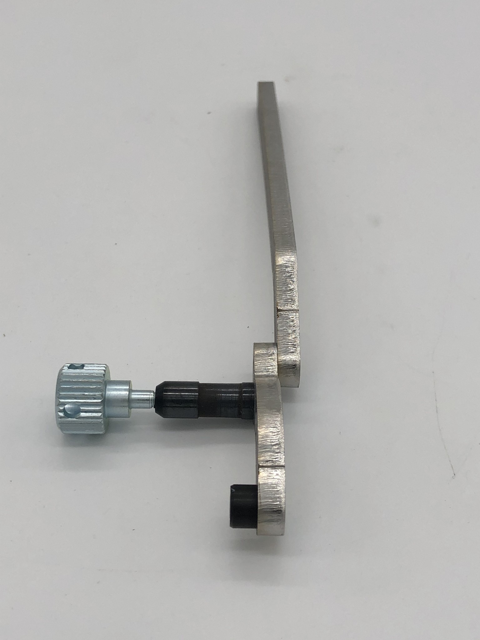 ADJUSTING TOOL FOR F-HEAD